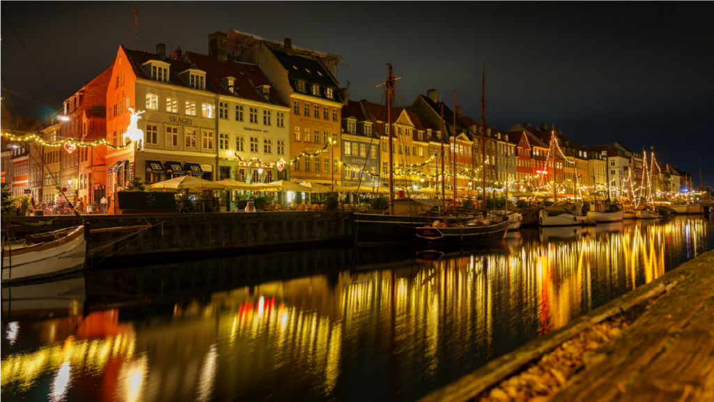 Nyhavn canal in Copenhagen at night, a prime example of Denmark's welcoming business environment for UK companies looking to expand into Scandinavia.