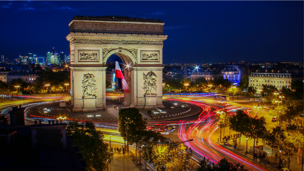 The Arc de Triomphe in Paris at dusk, symbolizing France's dynamic market and strong trade links with the UK for businesses seeking growth in Western Europe.