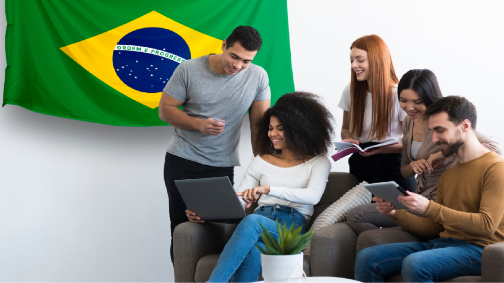 Group of people with tech devices and Brazilian flag, indicating international tech collaboration.