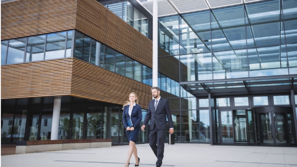 Two executives in a stride, symbolizing the forward movement and adaptability required to navigate the UK's statement of changes to immigration rules.